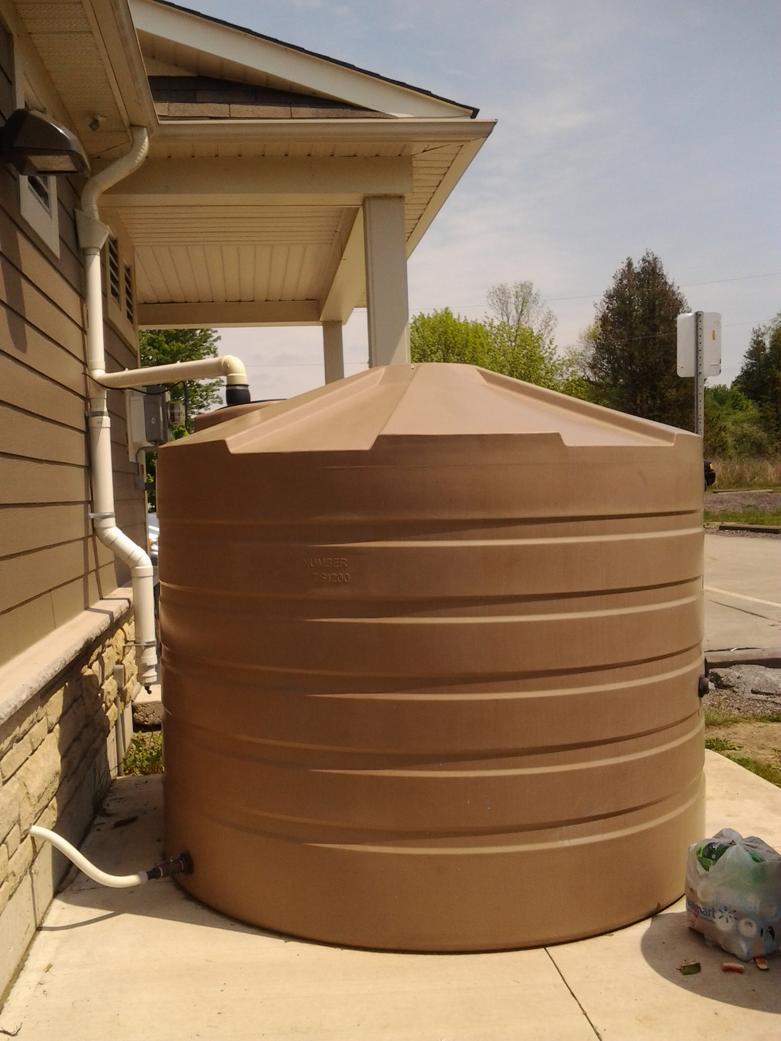 An above-ground cistern. This system is not frost proof, and would have to be drained and closed during winter.